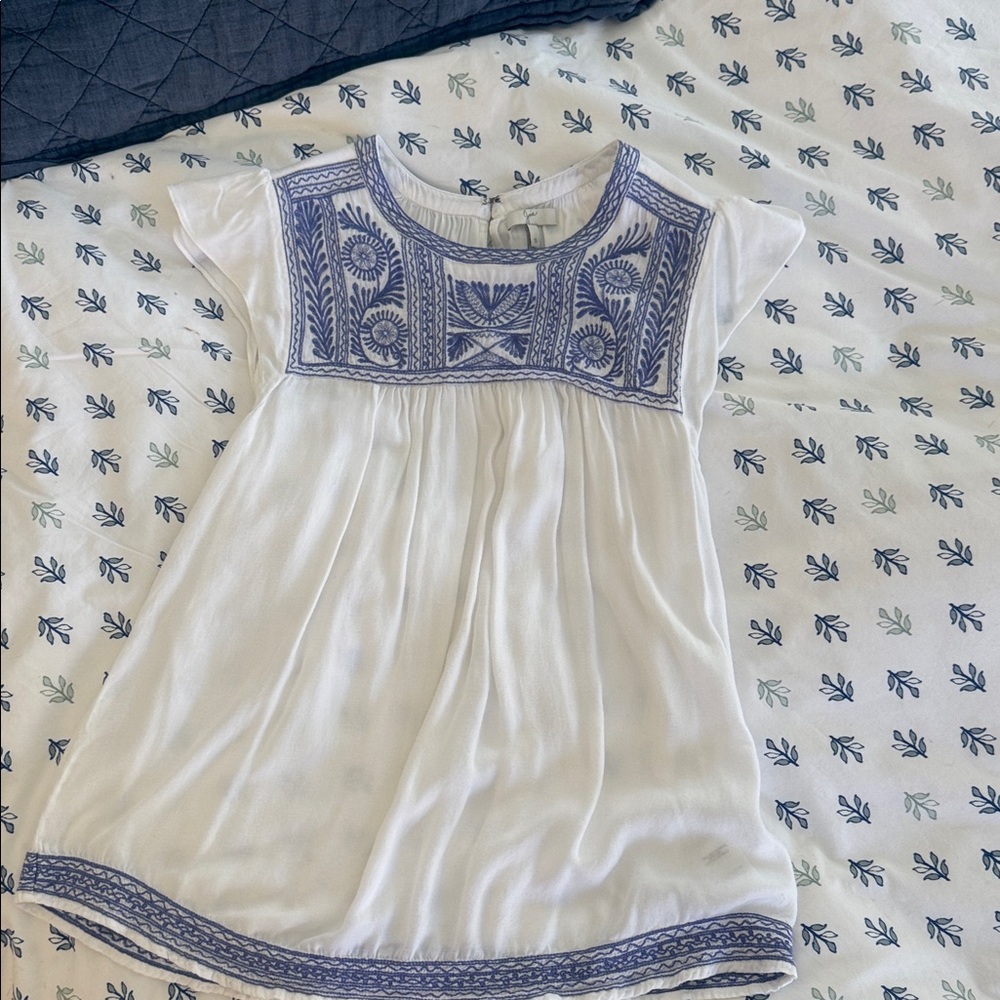 Joie White blouse with Blue Embroidery and butterfly sleeve.